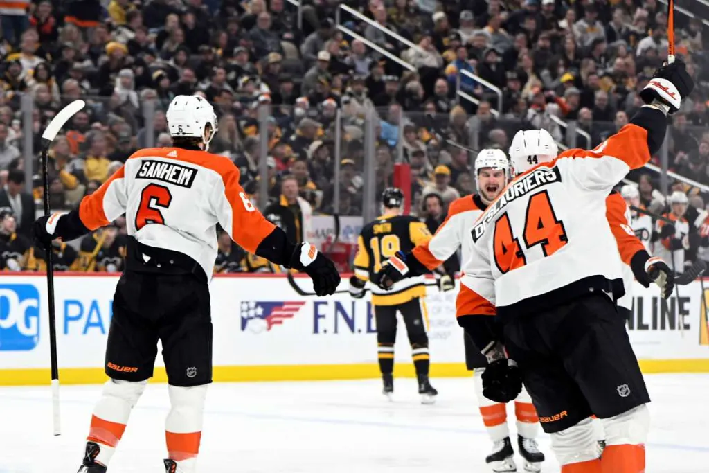 Philadelphia Flyers players Travis Sanheim and Nicolas Deslauriers celebrate a goal in Pittsburgh